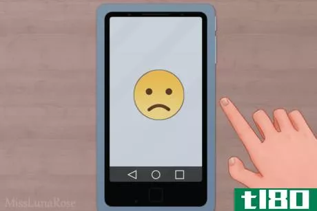 Image titled Hand and Phone with Sad Face.png