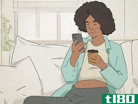 Image titled Woman sitting on her couch having a text conversation.