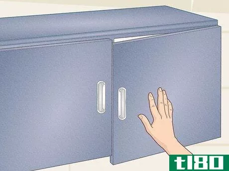 Image titled Fix a Cabinet Door Hinge Step 1
