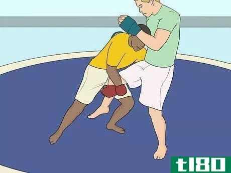 Image titled Do a Single Leg Takedown Step 2.jpeg