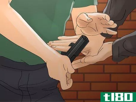 Image titled Disarm a Criminal with a Handgun Step 3