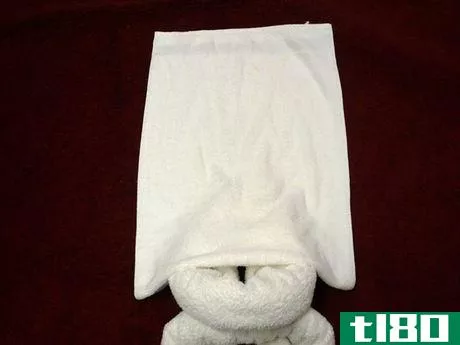 Image titled Hand towel laid on tail section.