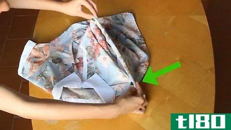 Image titled Fold a T‐Shirt in Two Seconds Step 6