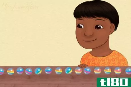 Image titled Autistic Boy Lines Up Marbles.png
