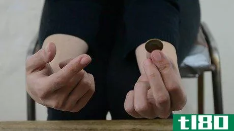 Image titled Do a Simple Coin Magic Trick Step 1