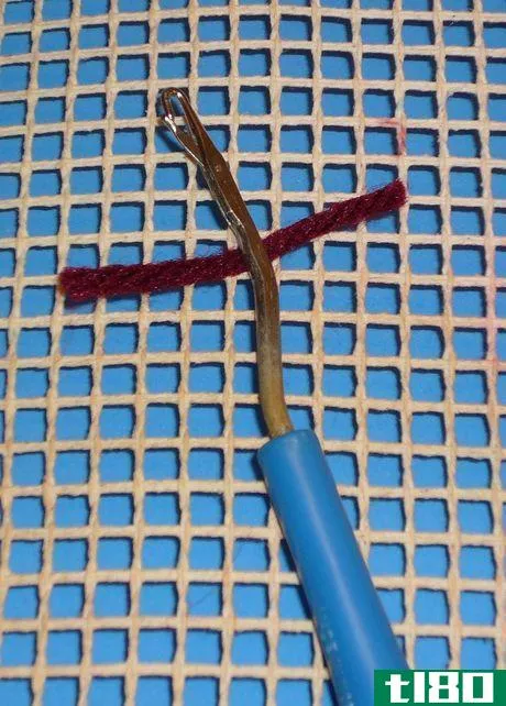 Image titled Push the hook under a horizontal canvas bar and back up to the top.
