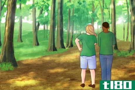 Image titled Two People Stroll in Quiet Forest.png
