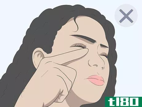 Image titled Get Sand Out of Your Eyes Step 1