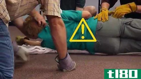 Image titled Logroll an Injured Person During First Aid Step 11