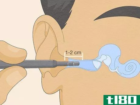 Image titled Look Into Your Own Ear Step 3