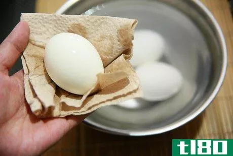 Image titled Peel a Hard Boiled Egg with the Crack and Roll Method Step 4