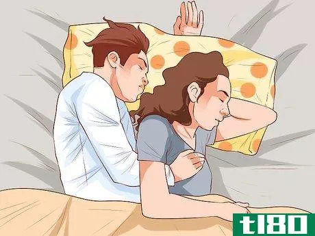 Image titled Avoid Trapping Your Arm While Snuggling in Bed Step 3
