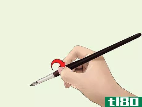 Image titled A person demonstarting how to properly hold a nib holder.