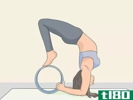 Image titled Use a Yoga Wheel Step 3
