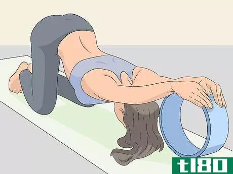Image titled Use a Yoga Wheel Step 5