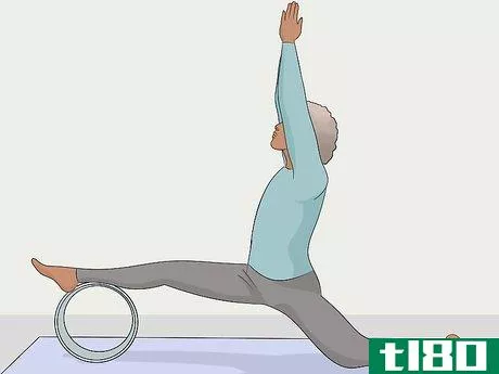 Image titled Use a Yoga Wheel Step 8