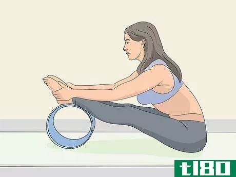 Image titled Use a Yoga Wheel Step 4