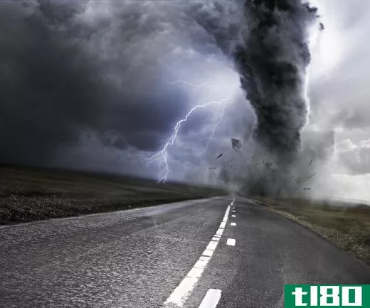 If a driver spots a tornado, he or she immediately should pull over and find a ditch to lie down in.