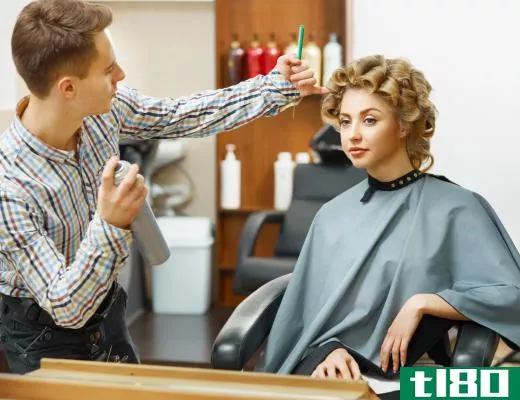 A stylist will gladly answer questions from a client looking to change their hairstyle.