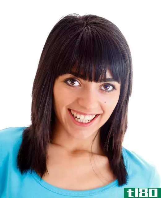 Bangs can frame a face, and are a popular choice for a round face.