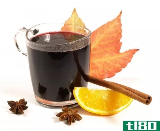 Mulled wine with a fall maple leaf.