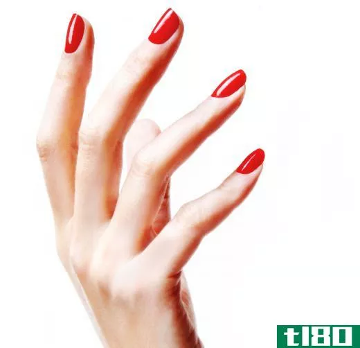Gel nails painted red.