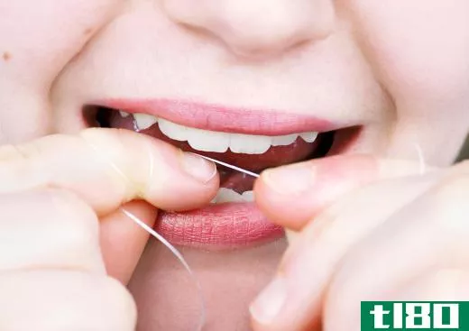 Brushing and flossing teeth ensures good daily oral hygiene.