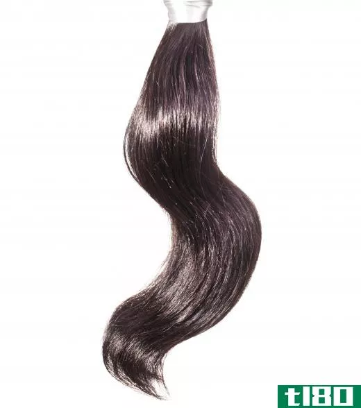 Hair extensions can be sewn or braided into or clipped or bonded to naturally growing hair.
