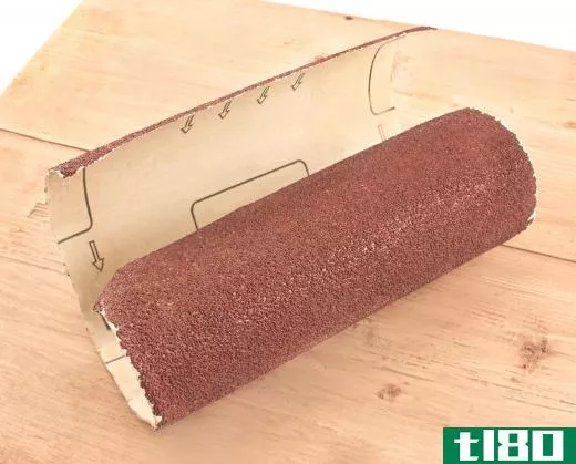 Metalworking sandpaper can be used to clean and sharpen tweezers.