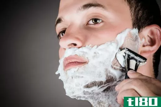 Some men use a razor and shaving cream to completely remove stubble.