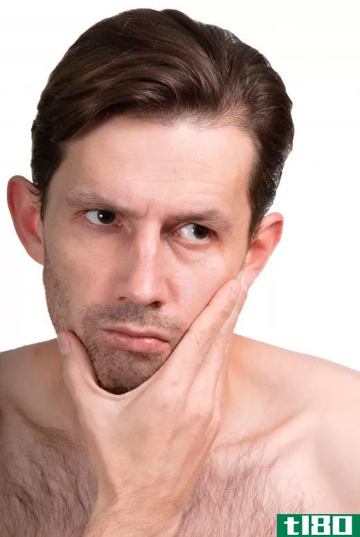 A black tint of stubble on a man's face is known as a five o'clock shadow.