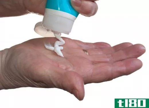 Lotion is applied to the hands during a massage.