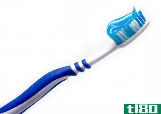 A toothbrush with natural toothpaste on it.