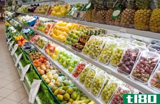 Various types of fresh fruit in a grocery store.