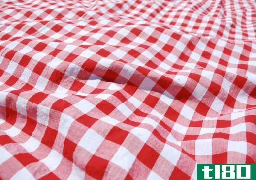 A tablecloth may be used to protect a table from spills.