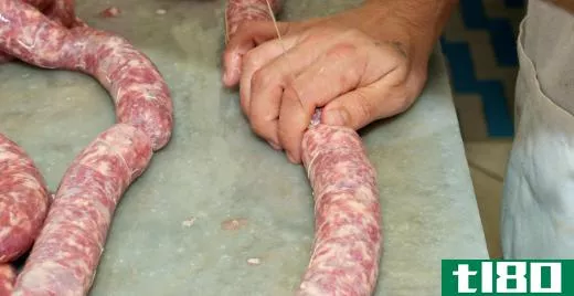 Sausage meat is typically stuffed into artificial or natural casings and tied then off at specific lengths.