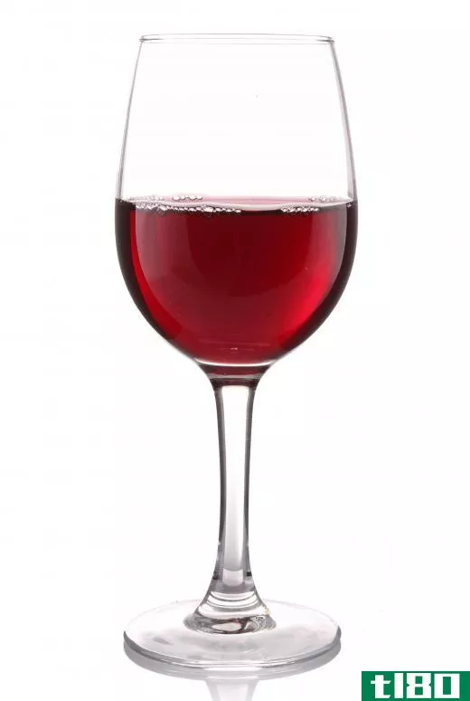 A glass of red wine from a screw-cap bottle.