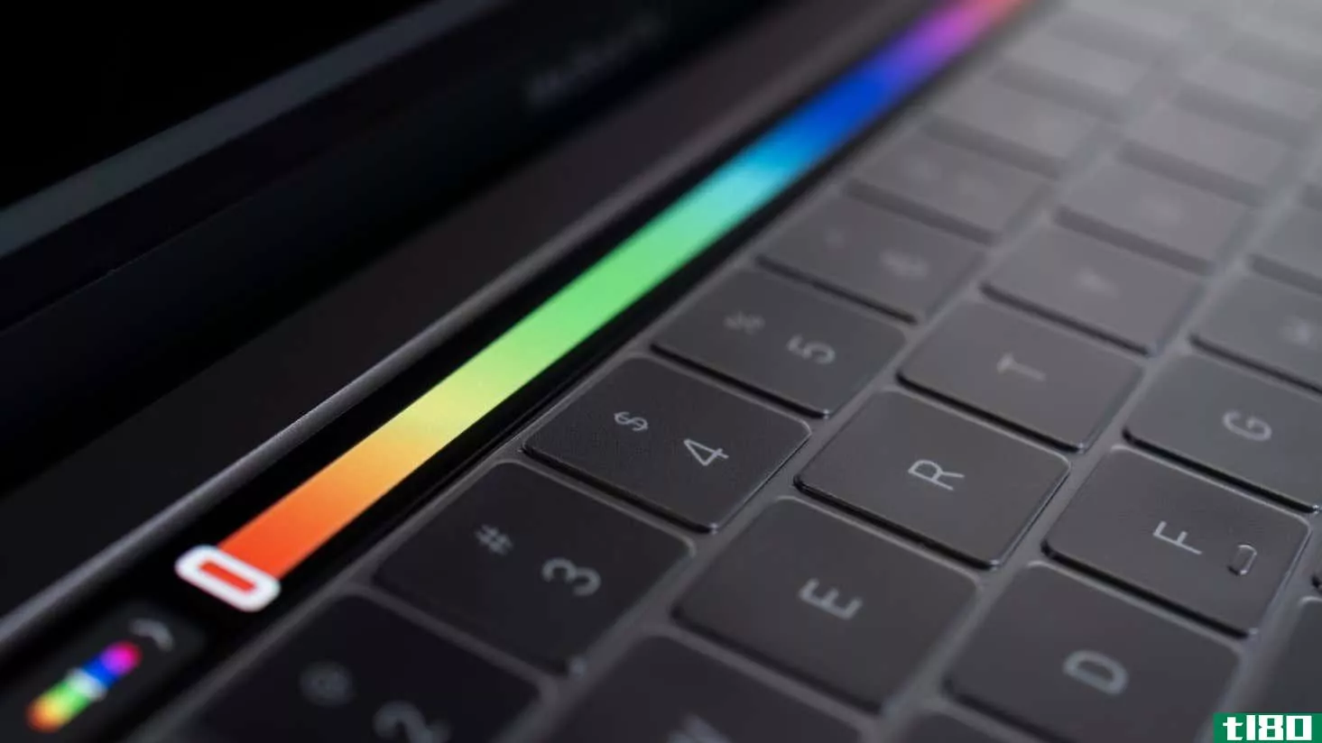 A closeup of a MacBook Touch Bar displaying a color slider