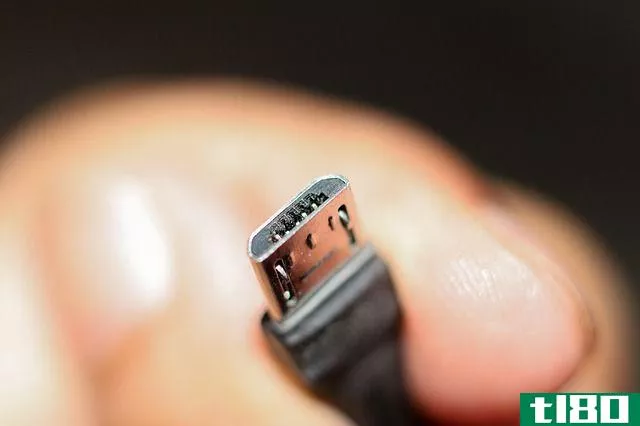 hand holding micro usb cable