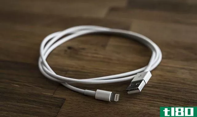 lightning cable on wooden surface