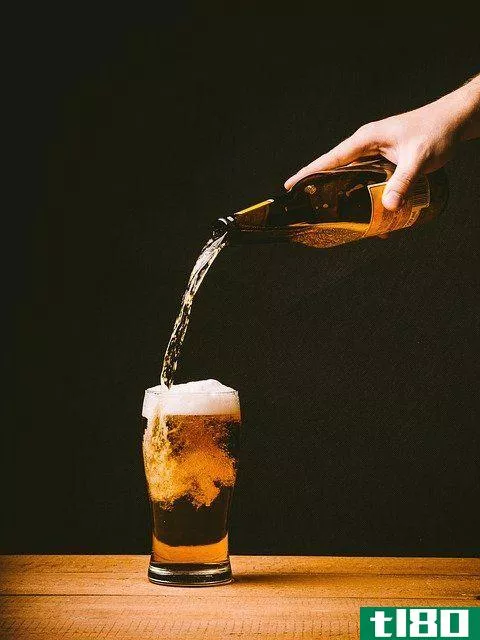 beer being poured into a pint glass