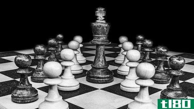 black and white picture of a chessboard with pieces