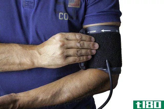 nurse measuring his own blood pressure
