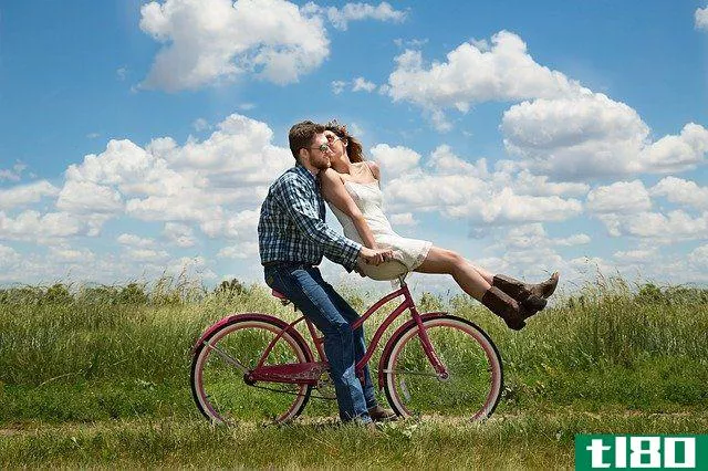 couple sitting on a bicycle