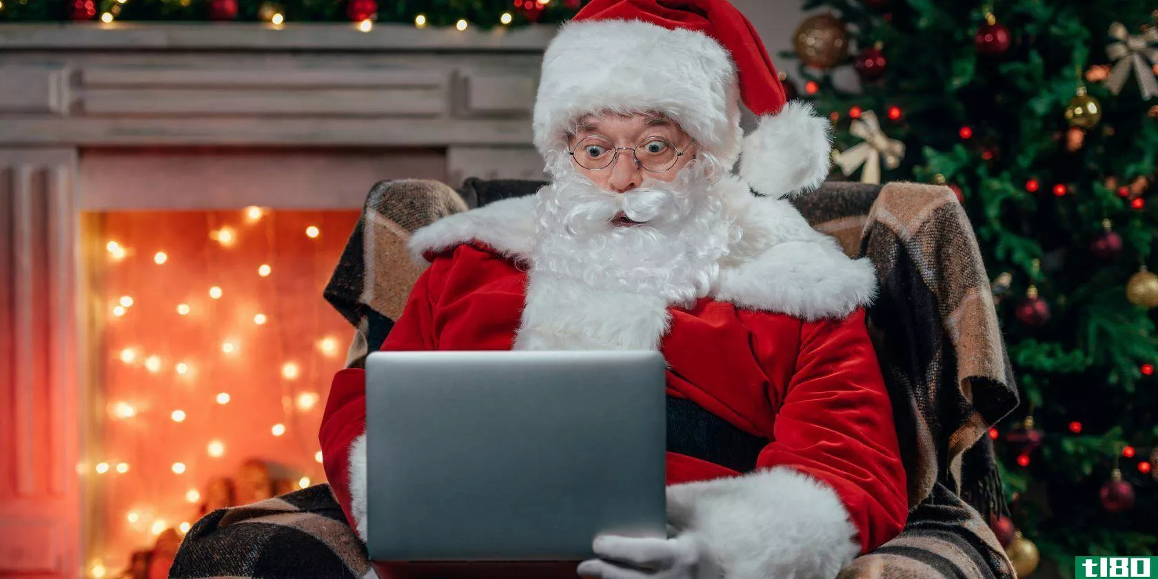 Santa Claus using a laptop