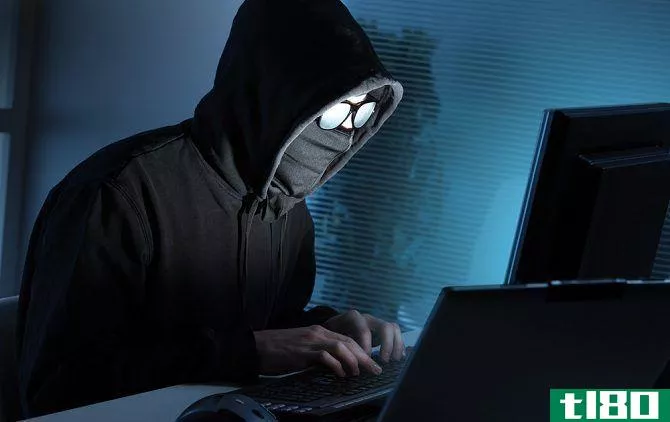 anonymous hacker on laptop