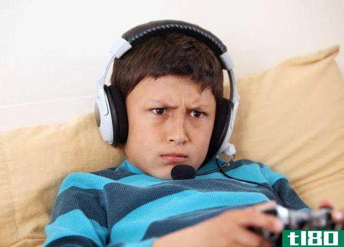 kid playing game with headset