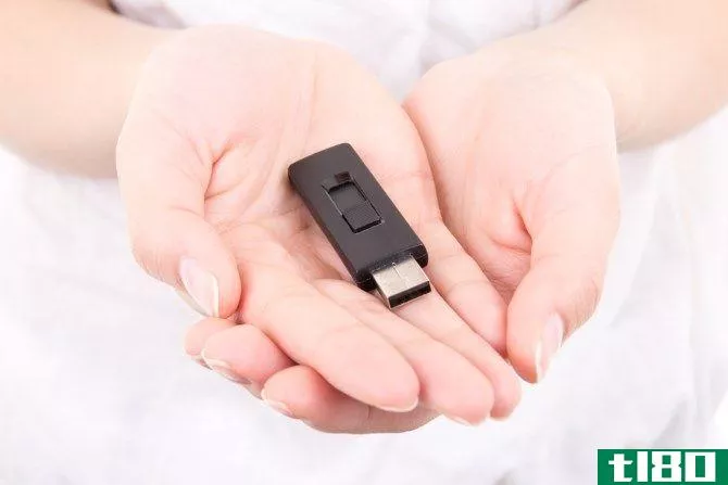 USB Drive Held in Hands