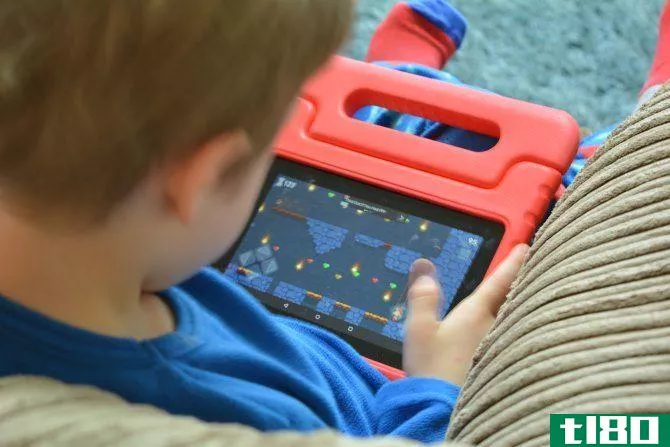 Child using an Amazon Fire tablet