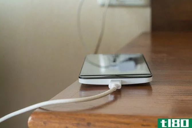 Phone Charging on a Wooden Table